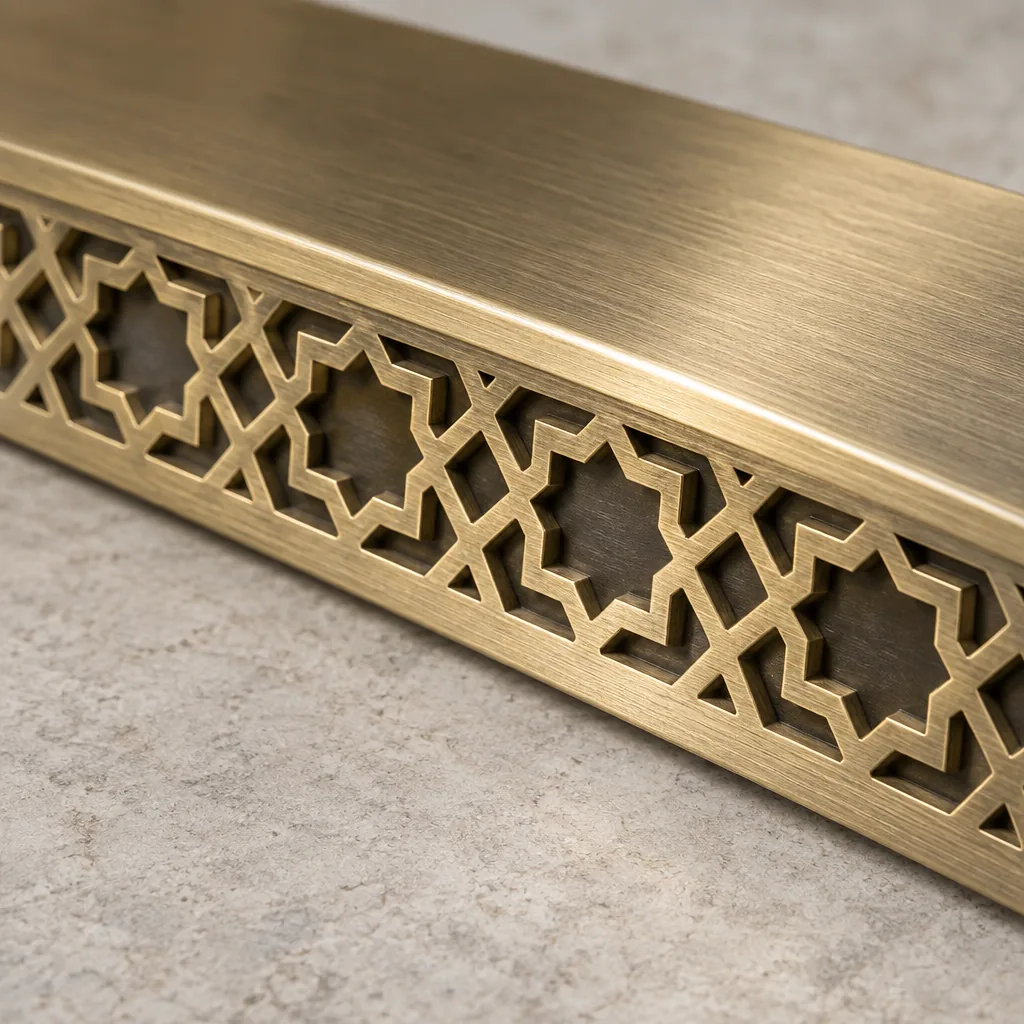 The cast edge of the brass sill plate
